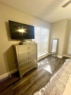 a bedroom with a tv on top of a dresser