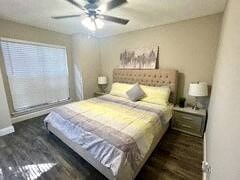 a bedroom with a bed and a ceiling fan