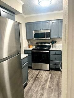 a kitchen with a stove and a refrigerator