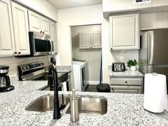 a kitchen with a granite counter top and a sink