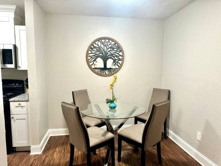 a dining room with a table and chairs