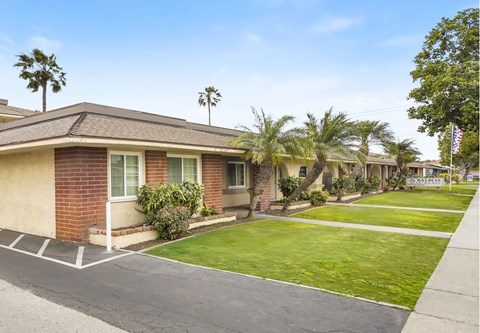 A house with a flag on the lawn.