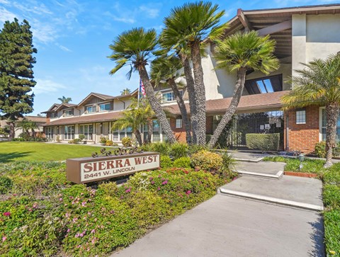 A sign that says Sierra West in front of a building.