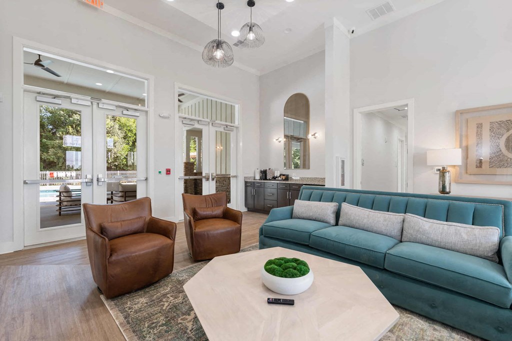 a living room with a blue couch and a coffee table