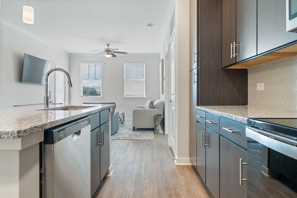 a kitchen with stainless steel appliances and counter tops