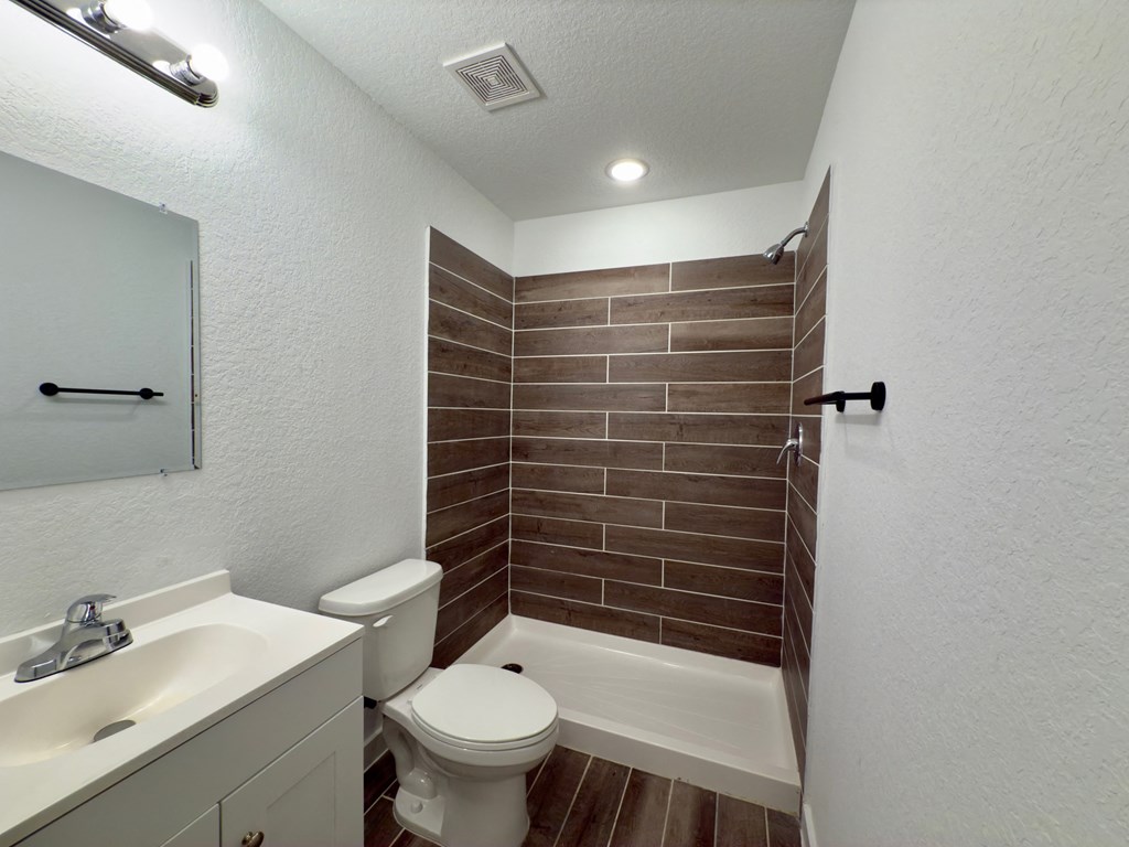 a bathroom with a toilet and a sink