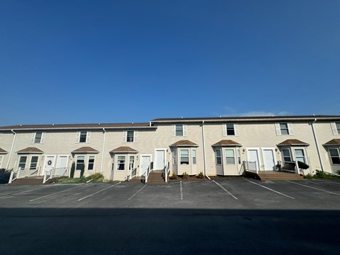 A long building with many windows and doors.