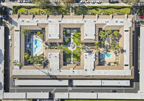A large concrete structure with a pool in the middle.