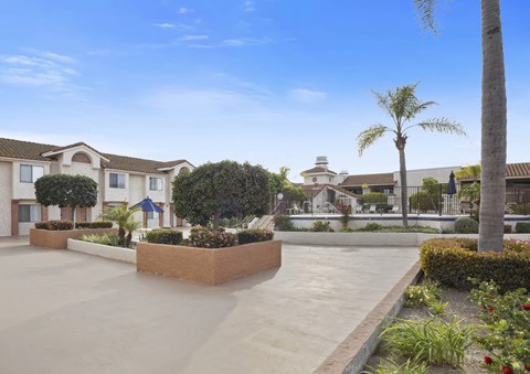 A sunny day at a residential complex with a clear blue sky.