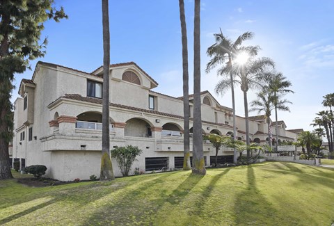 A large building with a lawn in front of it.