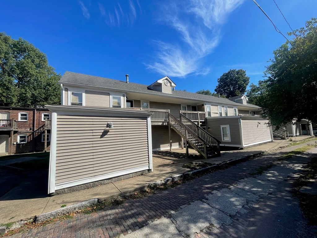 the front of a house with a garage and a driveway