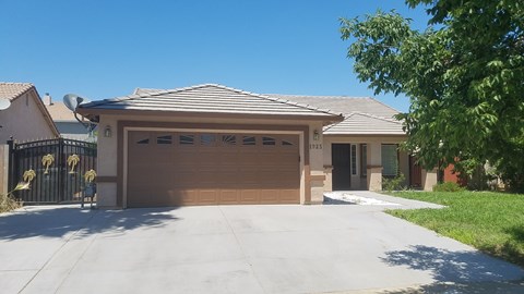 a house with a garage door and a driveway