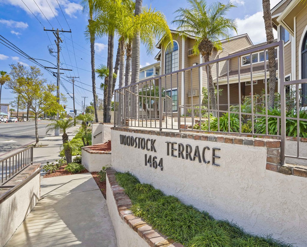 A white wall with the words "Woodstock Terrace 1464" on it.