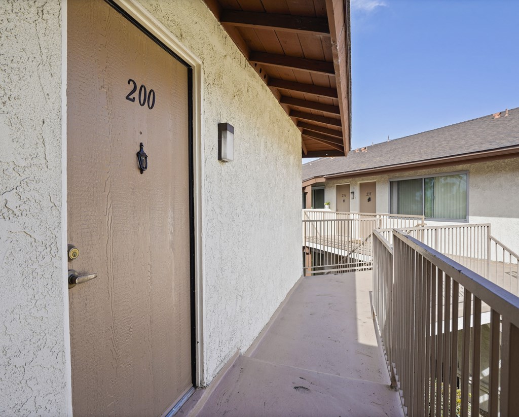 A brown door with the number 200 on it.