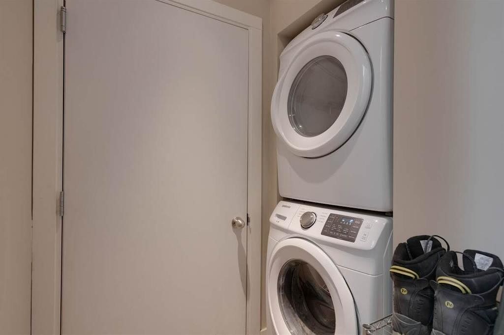 A pair of shoes are placed on a shelf next to a washing machine.