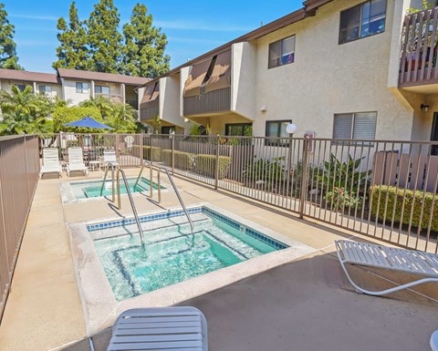 A pool with a slide in the middle of it.
