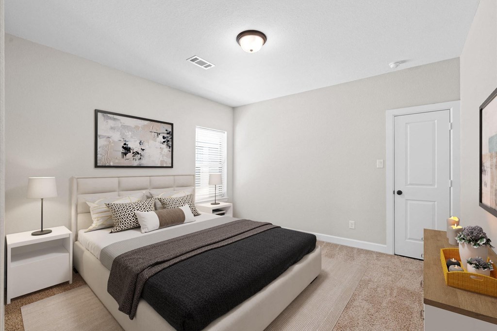 A bedroom with a bed, nightstands, and a painting on the wall.