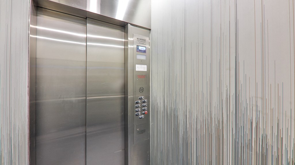 a stainless steel elevator in a building