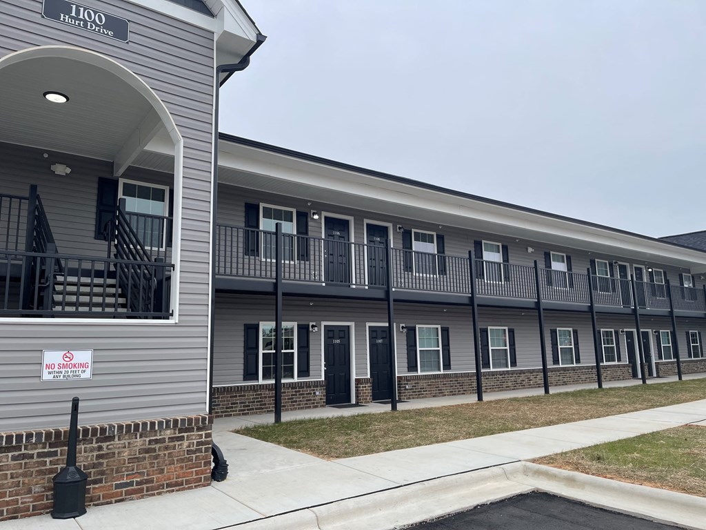 A building with a sign that says "NO SMOKING" on it.