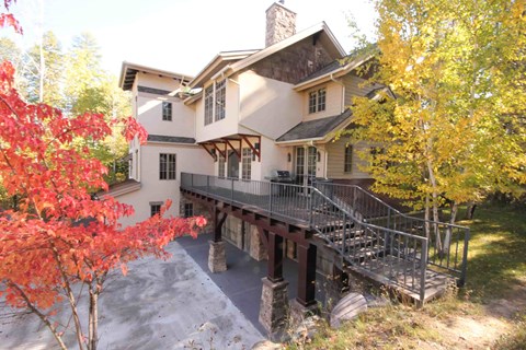a large house with a bridge in front of it