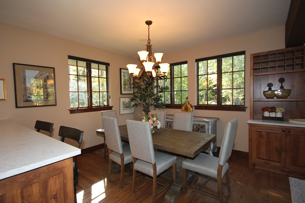 the dining room is open to the kitchen and the great room