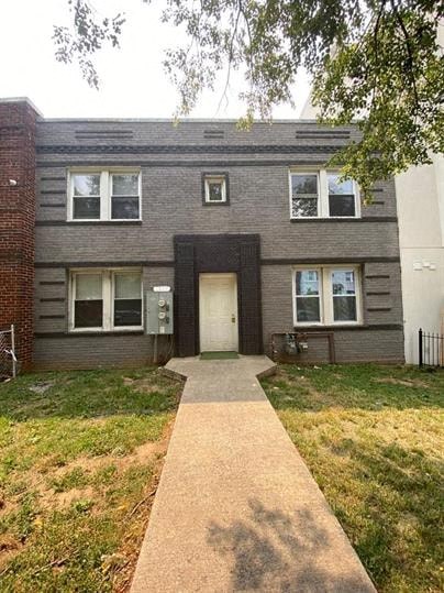 a house with a sidewalk in front of it