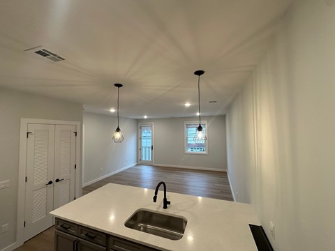 A kitchen with a sink and a window.
