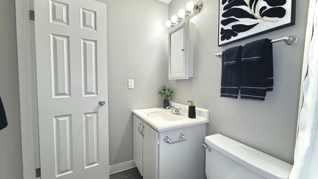 an empty room with a closet and a door