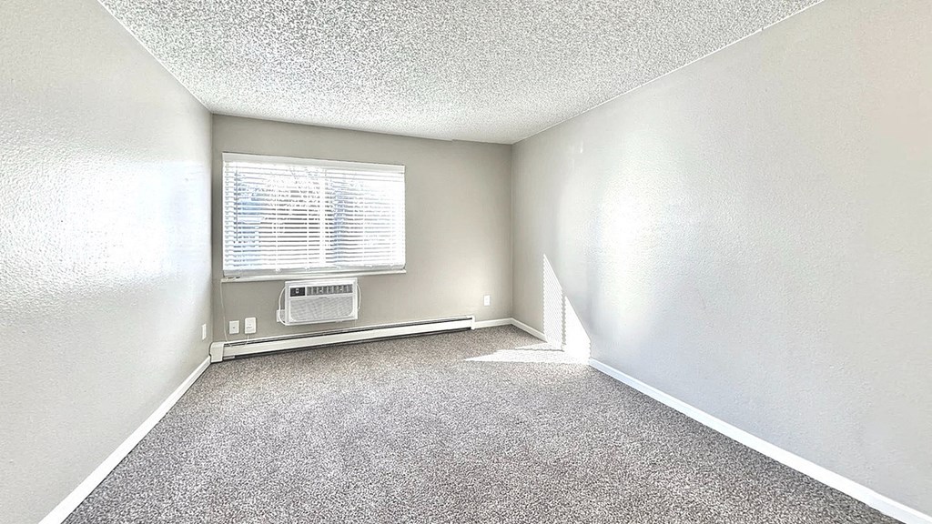 a living room with a couch and a tv