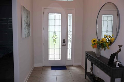 the entrance to the living room with the doors open