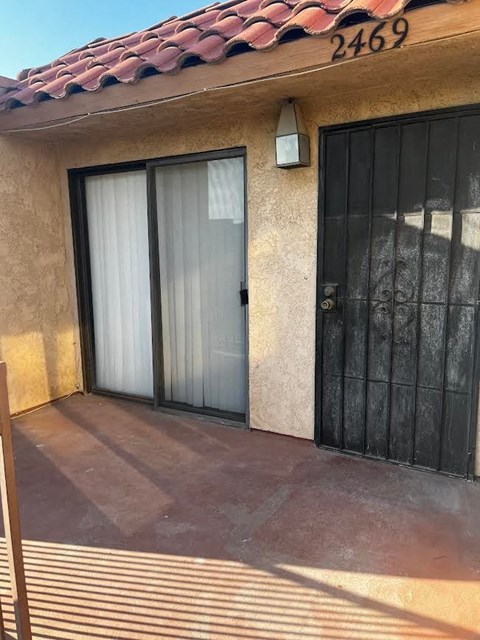 a house with a black door and a window