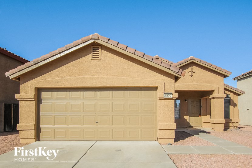 a house with a garage door in front of it
