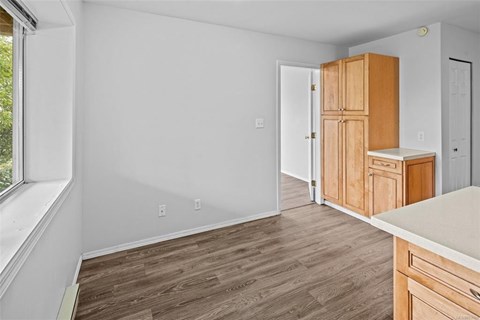 A kitchen with wooden cabinets and a countertop.