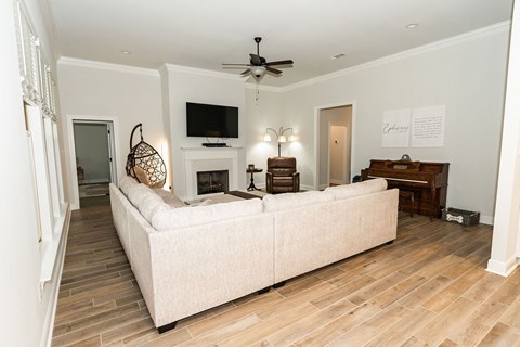 a living room with a couch and a tv