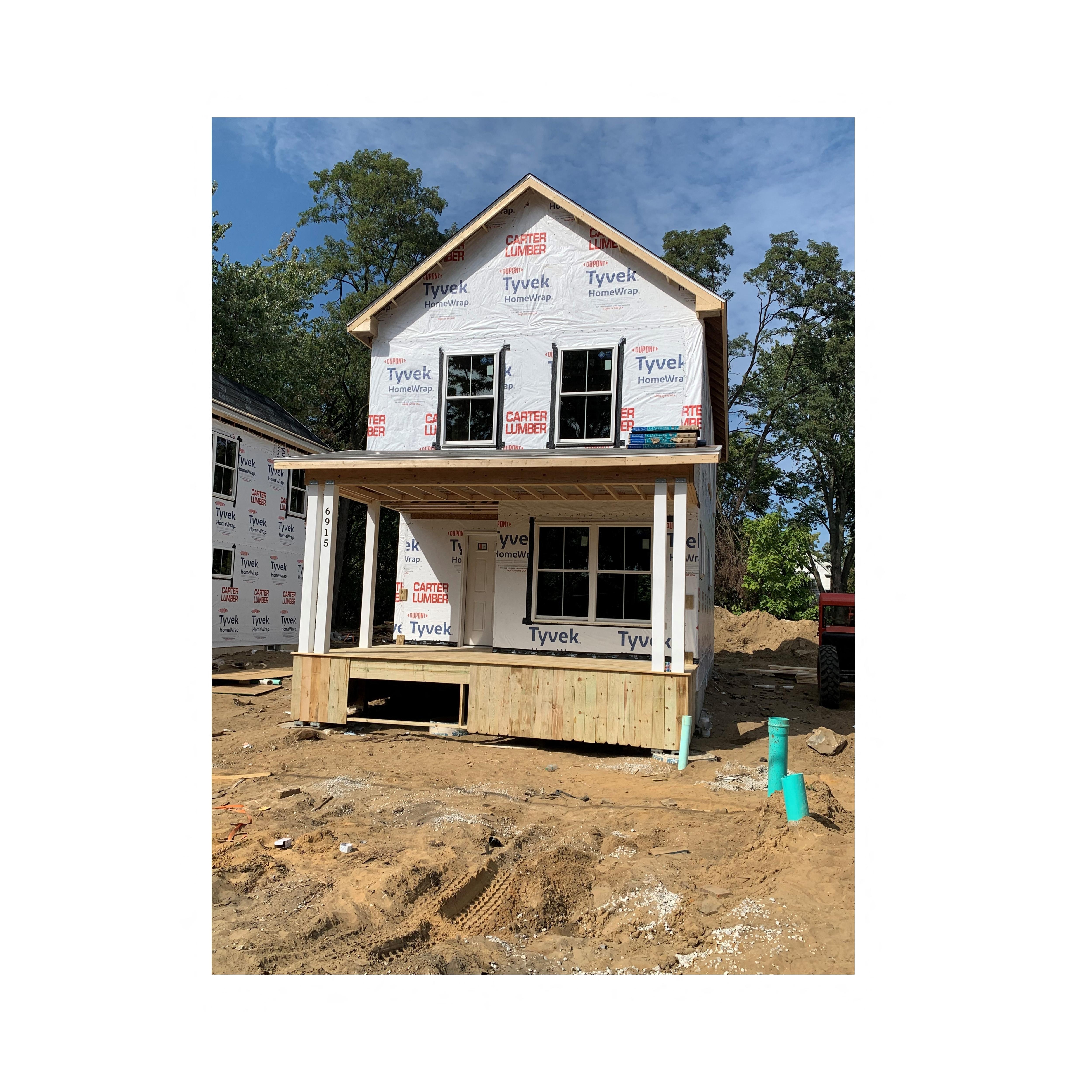 A house under construction with Tyvek branding on the exterior.