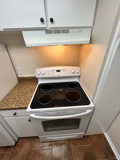 a kitchen with an oven and a counter top