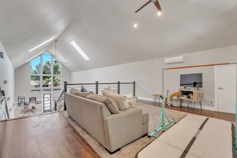 a living room with a couch and a tv