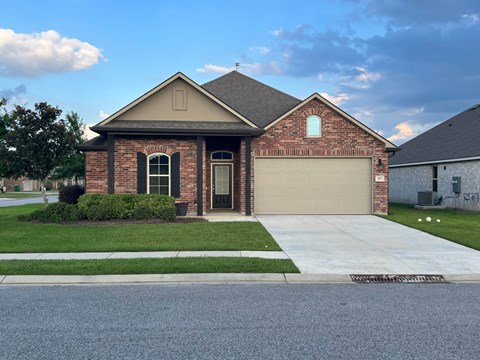 a house with a driveway and a garage door