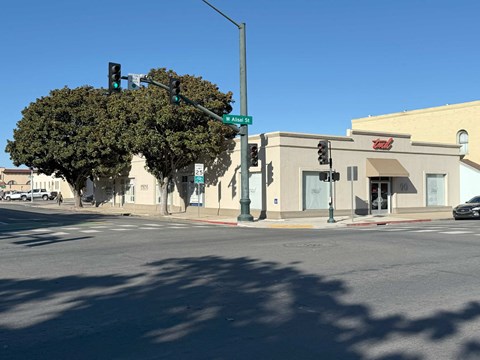 a city street with a traffic light and a building