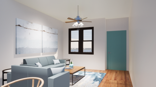 a living room with a couch and a ceiling fan