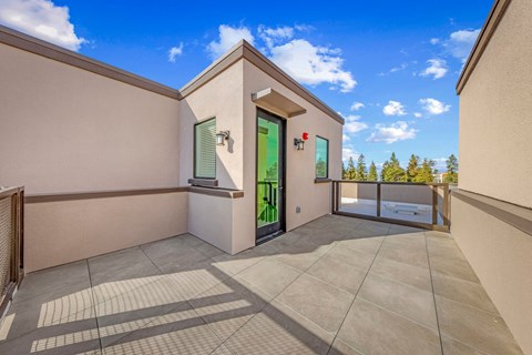the private balcony has a view of the pool and the trees