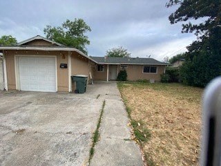 a house with a driveway and a white garage door