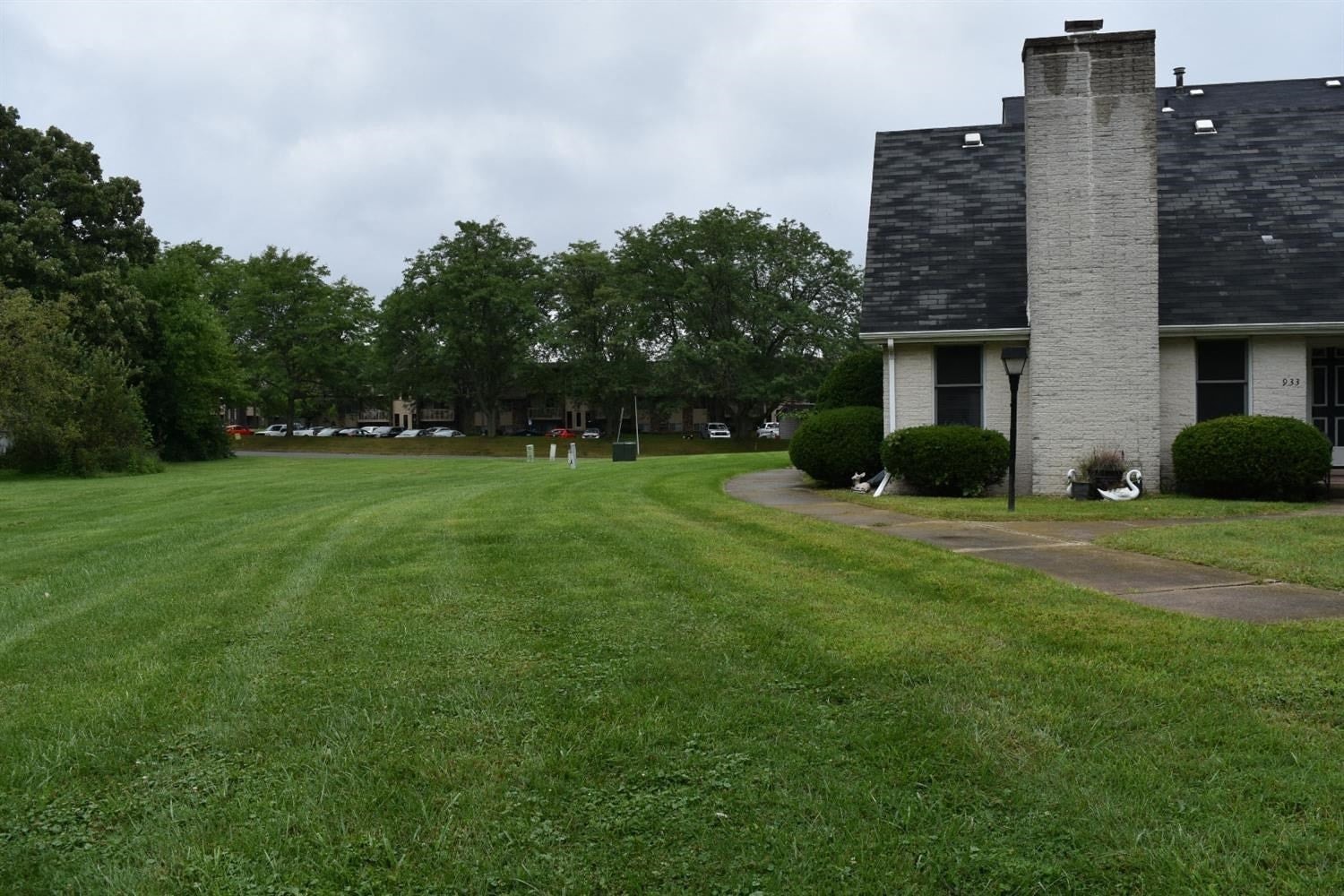 a house with a large yard and a lawn