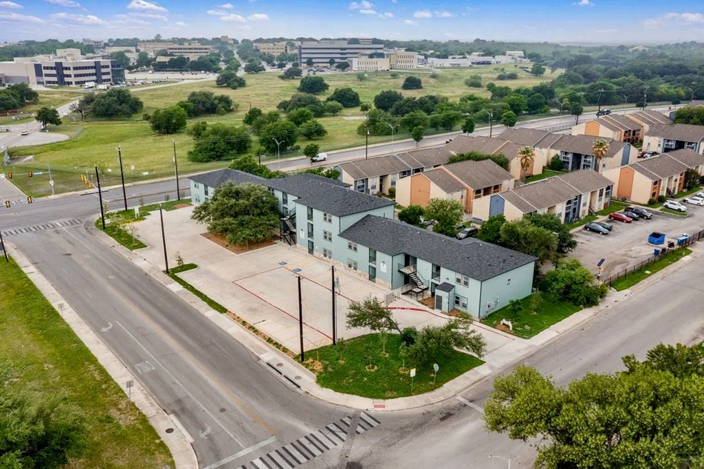 an aerial view of a group of houses in a city