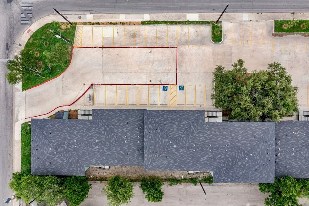 an aerial view of a basketball court in a parking lot