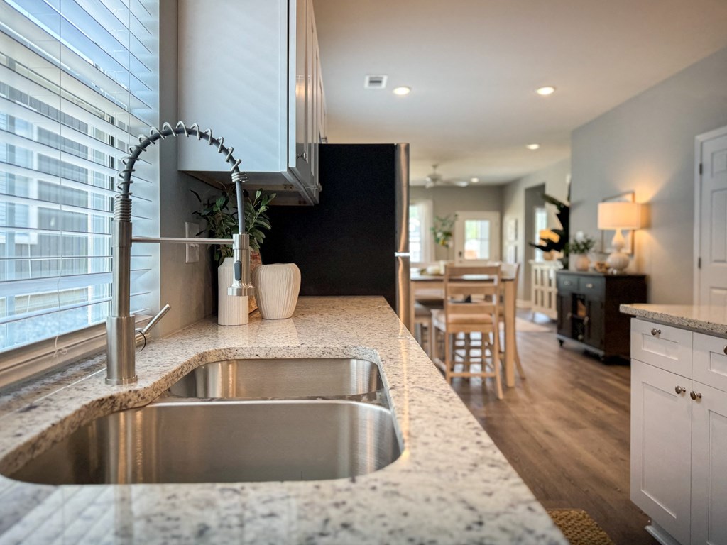 a kitchen with a stainless steel sink and a counter top