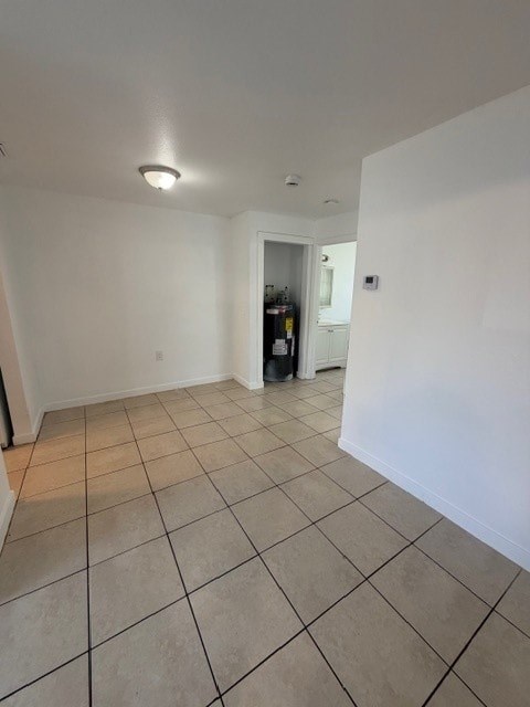 A room with white walls and a tiled floor.