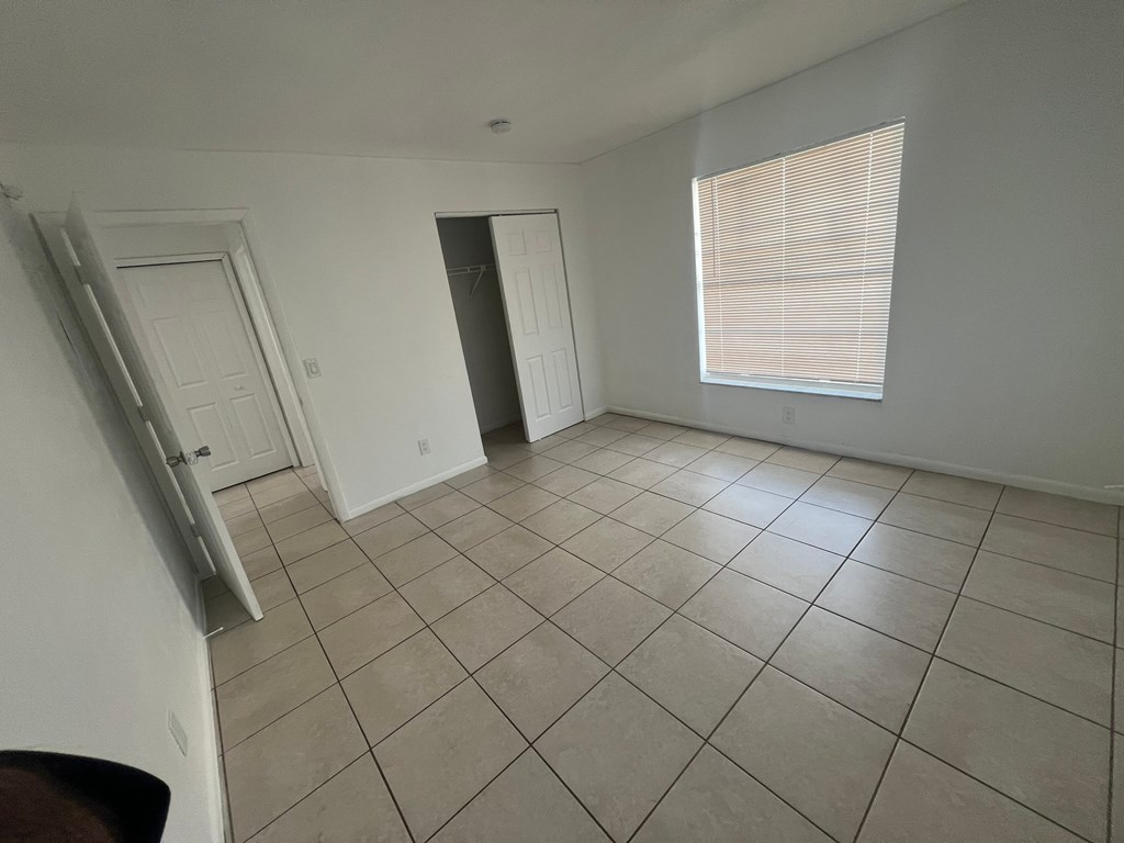A room with white walls and a tiled floor.