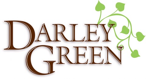 A logo with the words "Darley Green" in a brown serif font with a green vine graphic to the right.
