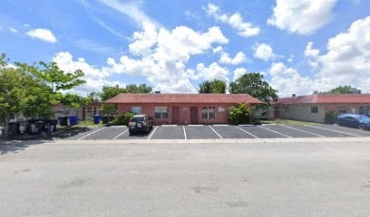 A parking lot with a building in the background.